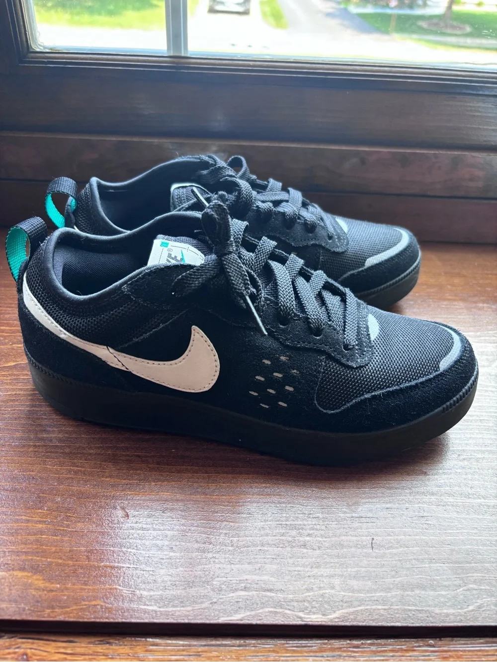 Nike Black Sneakers with Teal Accents